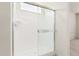 A modern glass enclosed shower provides a spa-like experience at 6722 W Desert Dr, Laveen, AZ 85339