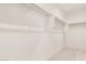 Walk-in closet featuring ample shelving and storage at 6722 W Desert Dr, Laveen, AZ 85339
