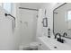 Bright bathroom with a modern vanity, stylish fixtures, and a walk-in shower at 7407 E Polk St, Scottsdale, AZ 85257