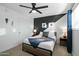 Comfortable bedroom with a ceiling fan, neutral colors, a closet, and bedside tables at 7407 E Polk St, Scottsdale, AZ 85257