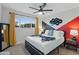Comfortable bedroom with modern accents, a comfortable bed, and plenty of natural light at 7407 E Polk St, Scottsdale, AZ 85257