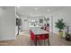 Eat-in kitchen features stainless steel appliances, white cabinets, a large island with seating, and modern decor at 7407 E Polk St, Scottsdale, AZ 85257