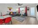 Living room includes a gray sofa, modern decor, and an open view to the kitchen with island seating at 7407 E Polk St, Scottsdale, AZ 85257