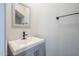 Updated half bath with a modern faucet, vanity, and mirror at 7675 E Mcdonald Dr # 222, Scottsdale, AZ 85250