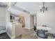 Charming dining area with a modern chandelier and easy access to the kitchen at 7675 E Mcdonald Dr # 222, Scottsdale, AZ 85250