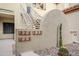 Well-maintained building exterior with Spanish-style roof and cacti at 7675 E Mcdonald Dr # 222, Scottsdale, AZ 85250