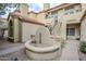 Exterior building with Spanish-style roofing and desert landscaping at 7675 E Mcdonald Dr # 222, Scottsdale, AZ 85250