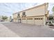 Exterior view of a garage row, showcasing multiple parking spaces at 7675 E Mcdonald Dr # 222, Scottsdale, AZ 85250