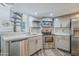 Modern kitchen featuring stainless steel appliances, white cabinets, and stylish backsplash at 7675 E Mcdonald Dr # 222, Scottsdale, AZ 85250