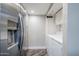 Convenient laundry area with stainless refrigerator and modern white appliances at 7675 E Mcdonald Dr # 222, Scottsdale, AZ 85250