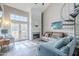 Inviting living room with a fireplace, spiral staircase, and bright natural light at 7675 E Mcdonald Dr # 222, Scottsdale, AZ 85250