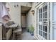 Charming front patio with a wood bench and shade umbrella at 7675 E Mcdonald Dr # 222, Scottsdale, AZ 85250