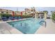 Community pool with plenty of lounge chairs and shady umbrellas at 7675 E Mcdonald Dr # 222, Scottsdale, AZ 85250