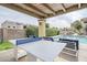Community pool area with ping pong table and lounge chairs at 7675 E Mcdonald Dr # 222, Scottsdale, AZ 85250