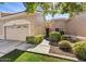 Charming single-story home with desert landscaping, attached garage, and neutral-toned facade at 8505 W Oraibi Dr, Peoria, AZ 85382