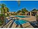 A tranquil community pool and hot tub with lounge chairs, perfect for relaxation at 8505 W Oraibi Dr, Peoria, AZ 85382