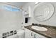 Bathroom featuring vanity, medicine cabinet, and shower/tub combo at 8611 W Village Dr, Peoria, AZ 85382