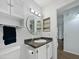 Clean bathroom with vanity, mirrored medicine cabinet, and decorative accents at 8611 W Village Dr, Peoria, AZ 85382