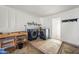 This garage features a washer/dryer, workbench, and storage shelves at 8920 N 56Th Ave, Glendale, AZ 85302