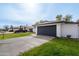 Attached two-car garage with a driveway and grassy yard, providing ample parking and curb appeal at 8920 N 56Th Ave, Glendale, AZ 85302
