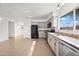 Bright kitchen features stainless steel appliances, granite counters, and ample cabinet space at 8920 N 56Th Ave, Glendale, AZ 85302