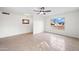 Bright living room featuring tile floors, large windows, and a ceiling fan at 8920 N 56Th Ave, Glendale, AZ 85302