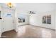 Inviting living room with bright windows, a ceiling fan, and tiled flooring at 8920 N 56Th Ave, Glendale, AZ 85302
