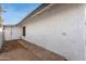Side yard with concrete walk-way along house, providing space between properties and secondary access at 8920 N 56Th Ave, Glendale, AZ 85302