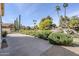 Spacious driveway with desert landscaping and mature trees at 9420 W Taro Ln, Peoria, AZ 85382