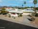 Eye-level shot highlighting the home's facade, desert landscaping, and attached garage at 9457 N 80Th Pl, Scottsdale, AZ 85258