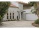 Stunning home exterior featuring a well-manicured lawn, a driveway, and a welcoming entrance with a stylish covered porch at 971 E Driftwood Dr, Tempe, AZ 85283