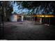 A backyard with sheds and a fence at 9716 E Birchwood Ave, Mesa, AZ 85208