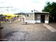Exterior of a single story home, with desert landscaping at 9716 E Birchwood Ave, Mesa, AZ 85208