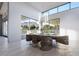 Bright dining room with mountain views, modern chandelier, and seating for six at 9790 N 56Th St, Paradise Valley, AZ 85253