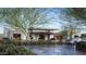 Contemporary home featuring clean lines, neutral tones, and an inviting entrance framed by lush landscaping at 9790 N 56Th St, Paradise Valley, AZ 85253