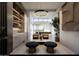 Open-concept living room features a wet bar and open access to a bright dining room at 9790 N 56Th St, Paradise Valley, AZ 85253