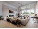Spacious living room with a modern fireplace, mountain views, and sliding glass doors to the backyard at 9790 N 56Th St, Paradise Valley, AZ 85253