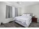 Serene bedroom featuring neutral tones, a comfortable queen bed, and modern fixtures at 11101 N 82Nd Dr, Peoria, AZ 85345