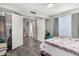 Cozy bedroom with gray flooring, ample closet space, and natural light from the window at 11101 N 82Nd Dr, Peoria, AZ 85345