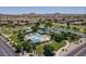 An aerial view of the community park with a pool, playground, and green space for residents to enjoy at 1145 E Silktassel Trl, San Tan Valley, AZ 85143