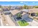 Aerial view of the beautiful home showcasing desert landscaping and solar panels at 1145 E Silktassel Trl, San Tan Valley, AZ 85143