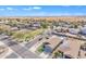 High-angle aerial view of a residential area with well-kept homes and organized streets under a blue sky at 1145 E Silktassel Trl, San Tan Valley, AZ 85143