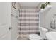 Small bathroom featuring a vanity with sink, toilet and shower-tub combination with a white and grey striped curtain at 1145 E Silktassel Trl, San Tan Valley, AZ 85143