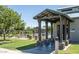 A covered walkway leads to a pool entrance with nearby seating areas at 1145 E Silktassel Trl, San Tan Valley, AZ 85143