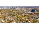 An aerial view of a bustling city neighborhood with a mix of residential and commercial buildings at 118 W Palm Ln, Phoenix, AZ 85003