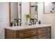 Elegant bathroom with a double sink vanity, quartz countertops, and modern fixtures at 118 W Palm Ln, Phoenix, AZ 85003