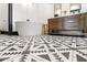 Bathroom with a freestanding tub, wood vanity, and patterned tile floor at 118 W Palm Ln, Phoenix, AZ 85003