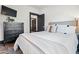 Well-lit bedroom boasts a plush bed, a sleek dresser, and black trim at 118 W Palm Ln, Phoenix, AZ 85003