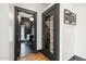 Hallway with a view of the secondary bathroom and the glass enclosed utility closet at 118 W Palm Ln, Phoenix, AZ 85003