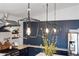 Stylish kitchen with dark cabinets, granite countertops, and pendant lighting over the island at 118 W Palm Ln, Phoenix, AZ 85003